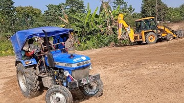 JCB 3DX Backhoe Machine Cutting Soil and Loading in tractor