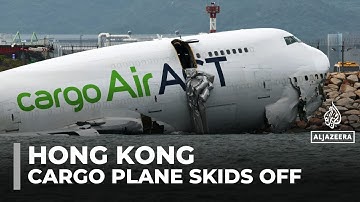 Two killed as cargo plane skids off Hong Kong runway