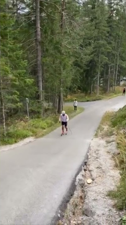 Guy Doing a Cross Country Ski Sprint Training on Asphalt