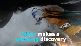 Watch what happens when a skier discovers a snowboarder buried head-first under snow