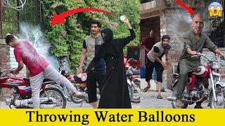Throwing Water Balloons with twist | Throwing Water Balloons Prank