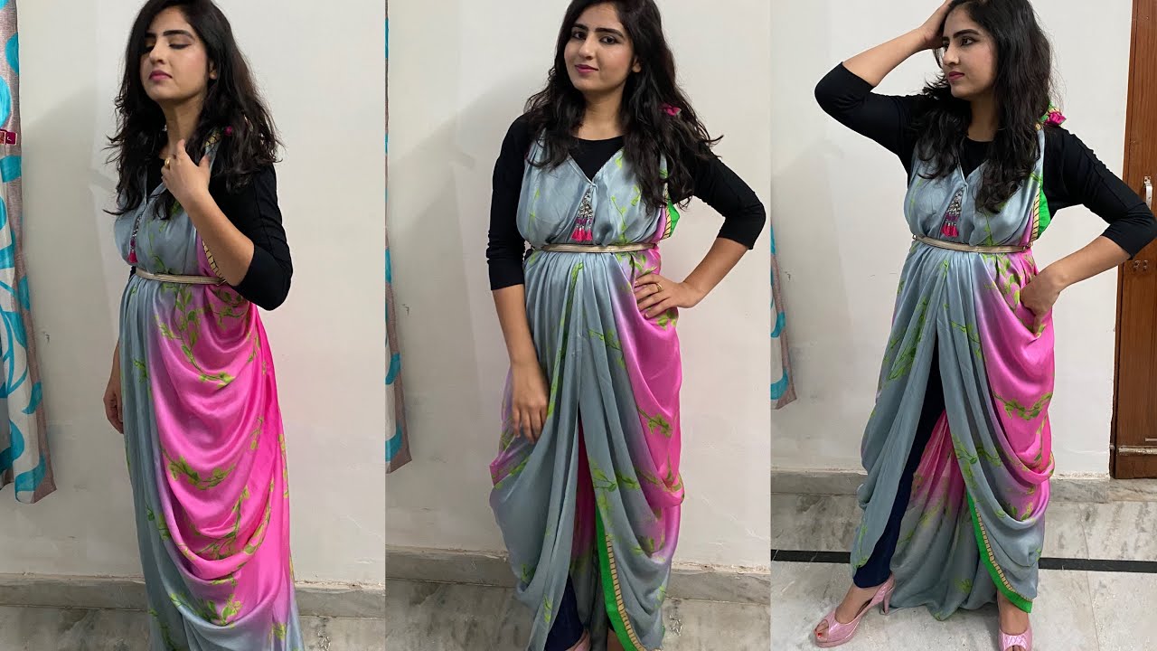 A woman wearing a sari draped as a cocktail dress, showcasing the high waist and flowing fabric