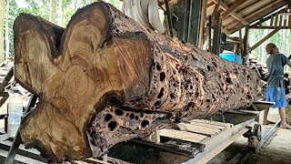 Hundreds of pieces of premium teak wood are being processed for shipment to Australia