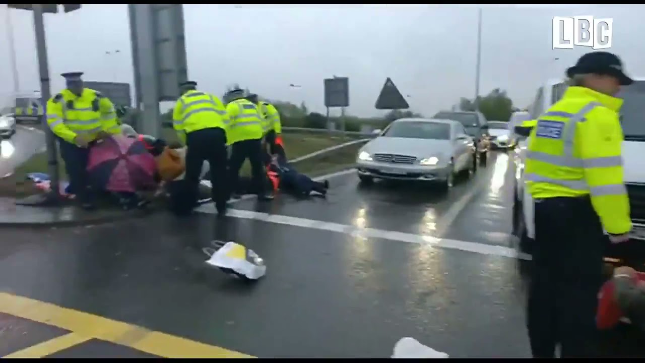 Environmentalists block traffic in BRITAIN.