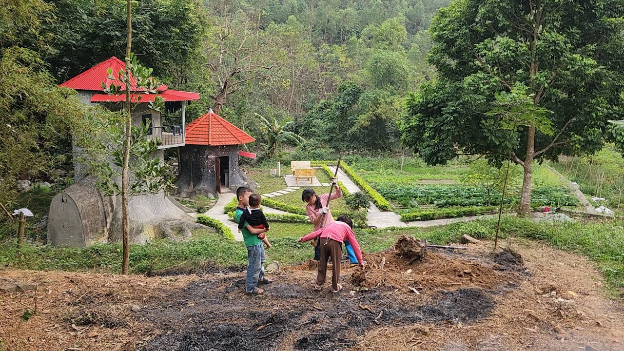 Clearing weeds to build steps leading up to the farm.
