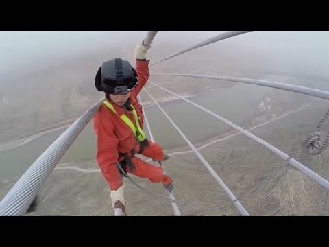 Workers make final checks on China's new power line