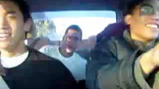 Teenagers in car doing the Venga Boys headbang