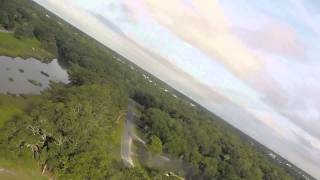 Apprentice with gopro flying over marsh