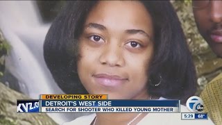 Woman shot, killed while driving in Detroit
