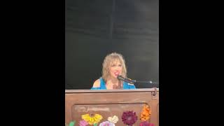 Taylor swift with a surprise song \