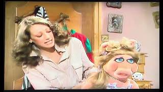 The Muppet Show: Dressing Room Moment with Marisa Berenson
As Miss Piggy was getting ready for her wedding sketch Marisa Berenson decided to come in and help her. Marisa thought that this is a real wedding than a sketch. Piggy said that this is a realistic sketch. Then Marisa helped Miss Piggy by lacing her. Scooter came in and told Marisa that it’s time to get ready for her musical number. The Muppet Show: Dressing Room Moment with Marisa Berenson