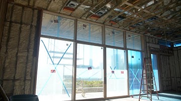 Loewen Lift & Slide Doors inside a Curtain Wall Window System