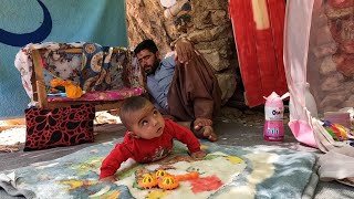 Painting the hut and cooking food for the baby by his father in the mountains