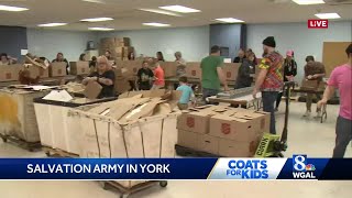 Volunteers pack up boxes of food at Salvation Army in York