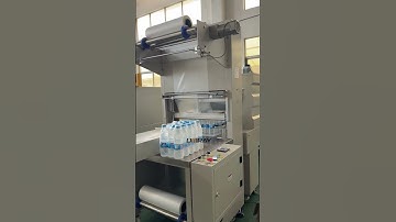 PET bottle beverage mineral water shrink packaging machine #packagingmachine  #shrinkwrap #factory