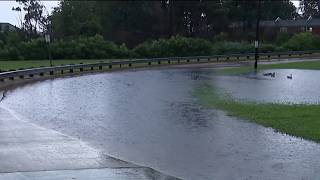 Rains flood Route 13 in Wilmington, Del.