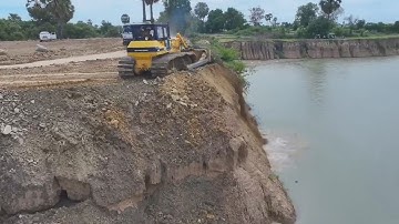 Great Project! High Deep Pond Filling Up Power Team Dump Truck Bulldozer KOMATSU D60P Pouring Stone