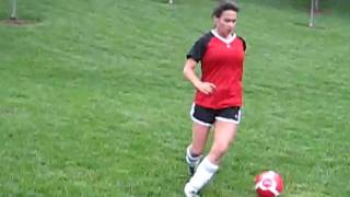Rhiannon playing soccer - heading the ball & dribbling
