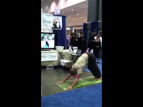 Infinity Strap being demonstrated in Handstand and Sun Salutation