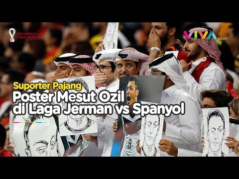 Poster Mesut Ozil dan Gestur Tutup Mulut di Laga Jerman vs Spanyol