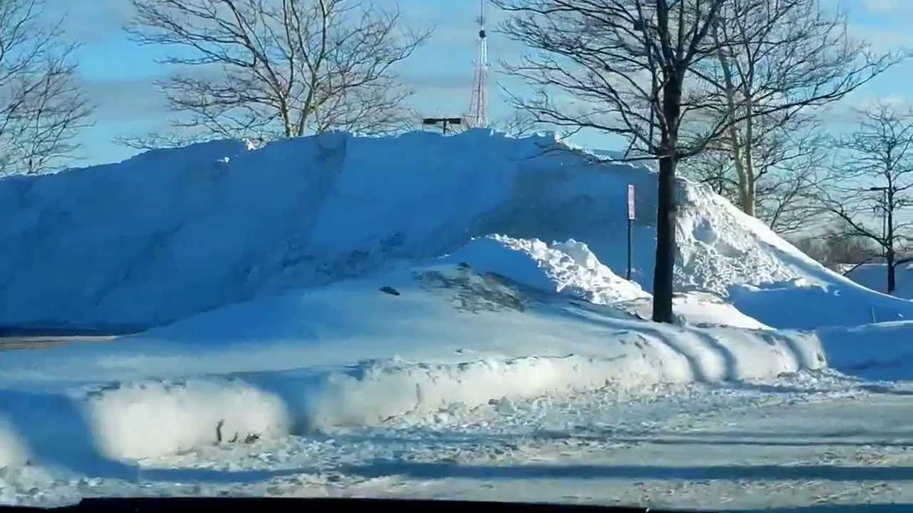 Crazy snow piles in the parking lots YouTube