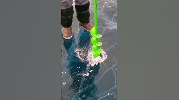 process of drilling holes in the ice floor using a special green cutting tool that is easy to drill.
