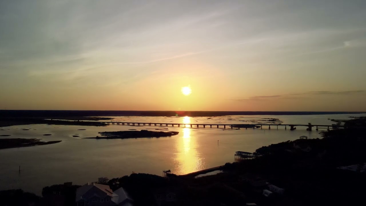 SUNSET WIDE Inter-coastal Waterway with long bridge - 4K 16:9 24FPS