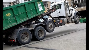 Crazy roll-off truck driver.