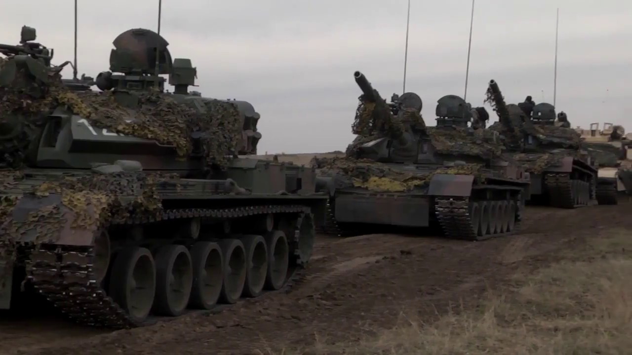 US and Romanian forces train in the wind and rain