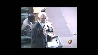K D Knight speaking in parliament on PNP achievements.