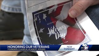 Students performed for veterans at a ceremony in Rogers