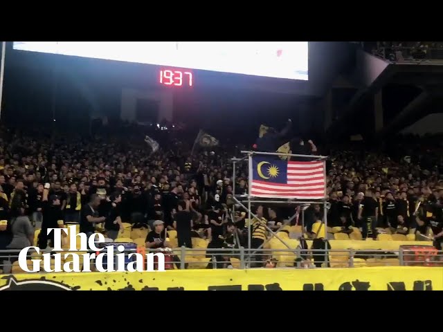 Malaysia fans perform collective chants before game with Indonesia class=