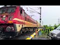 Heavy Rainfall Scene : High speed Intercity Express Moving Throughout Railway Crossing 