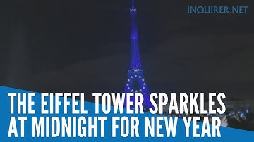 The Eiffel Tower sparkles at midnight for New Year