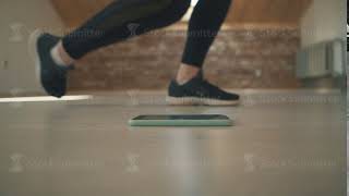 Girl Make Several Steps And Sit On Floor For Click Blue Phone