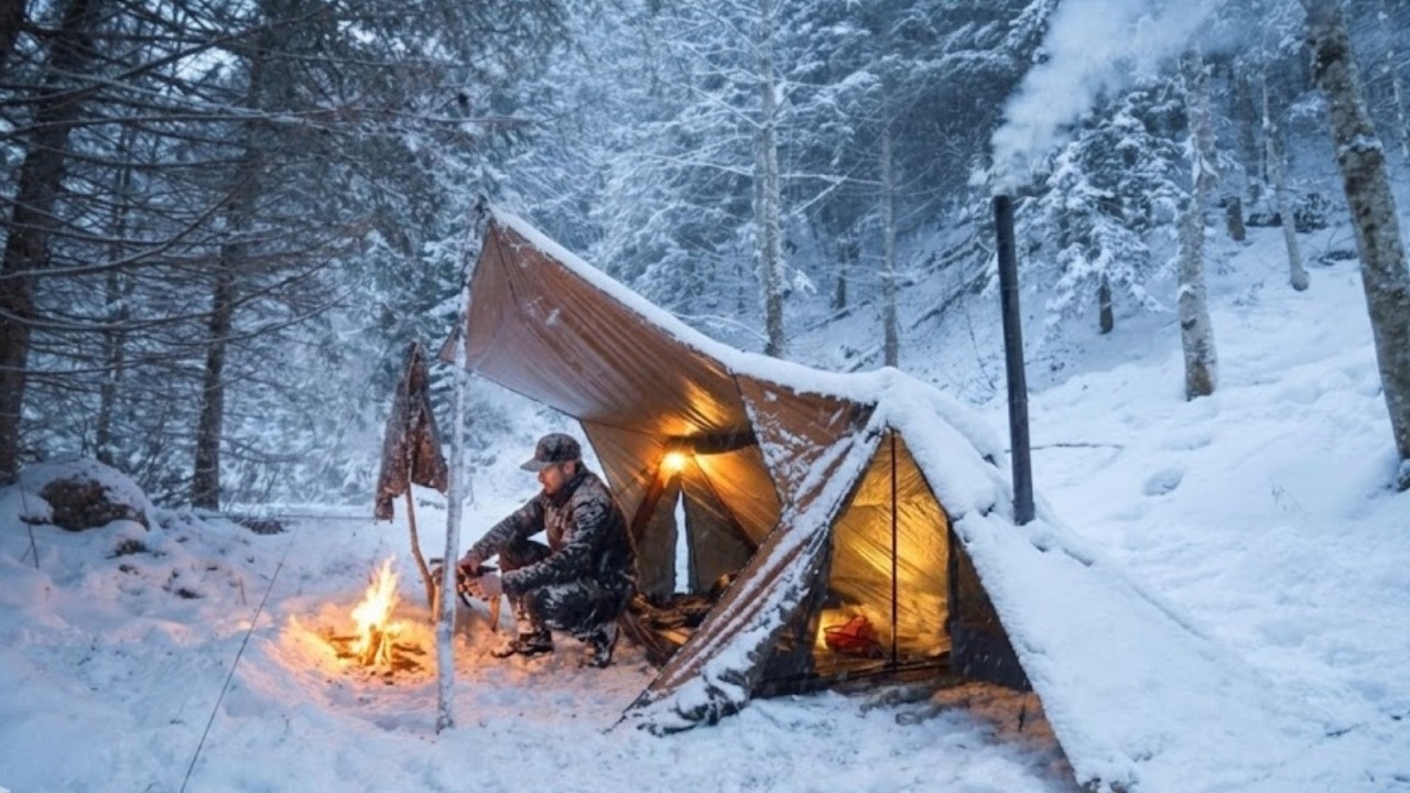 I camped during a snowstorm, cooking and sleeping in a warm tent despite the sub-zero cold.