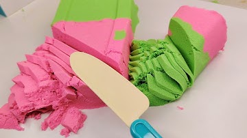 "Bright, multicolored sand sparkling in sunlight, tiny grains forming magical, playful patterns."