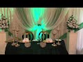 Emerald green and gold head table setting
