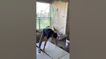 the process of installing large ceramic tiles on the floors of multi-storey buildings #construction