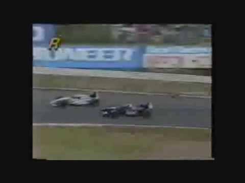 heinz harold frentzen collides with eddie irvine and loses his front wing at the japanese grand prix in 1995