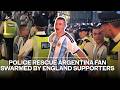 Dramatic moment police rescue Argentina fan swarmed by England supporters