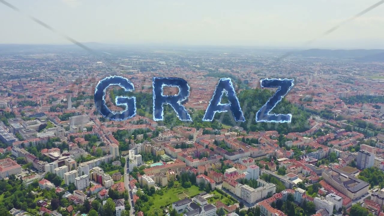 Inscription on video. Graz, Austria. The historic city center aerial view. Mount Schlossberg (Castle