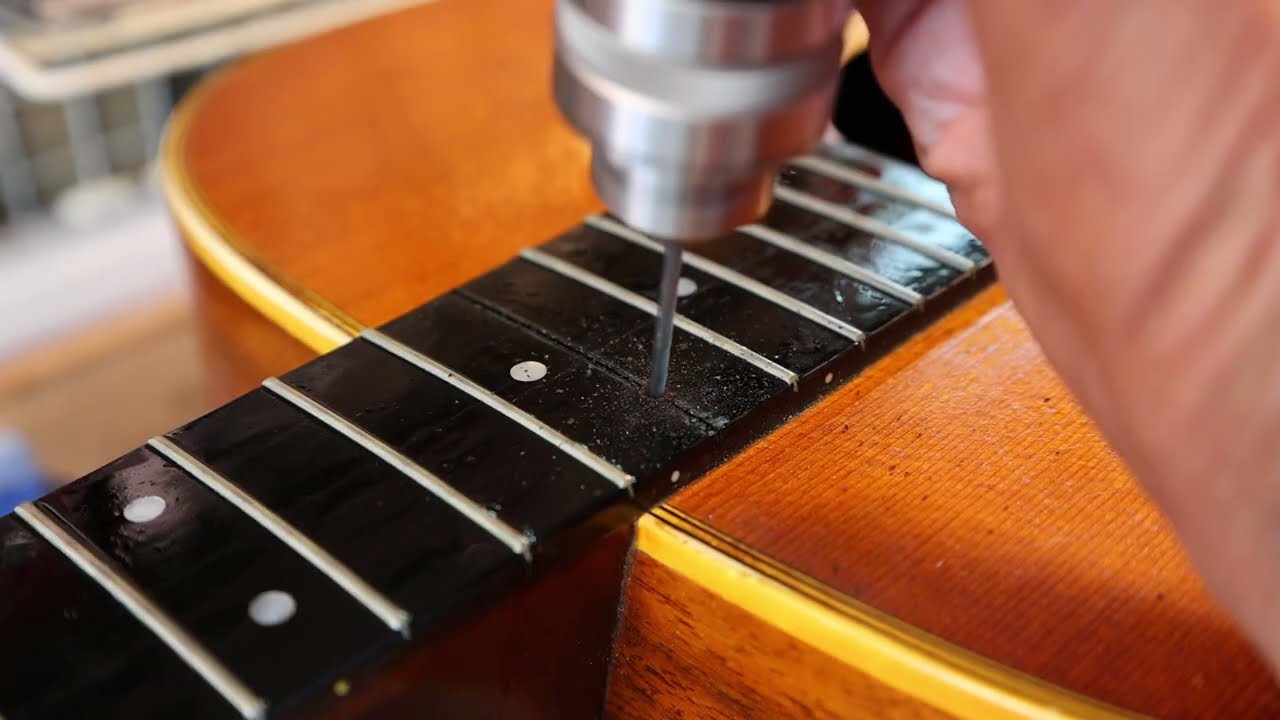 Drilling an access hole into the neck pocket on Martin D-28