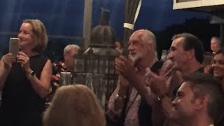 Mick Fleetwood enjoys bagpipe player, Innis, at his restaurant, Fleetwoods Maui.