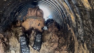 Removing Tons of MUD from inside a beaver dam culvert.