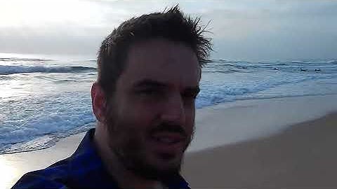 Surfers going into the sea