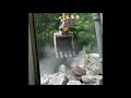 Moving large rock (rip rap-shot rock) with a 145 Wacker Neusen Excavator.