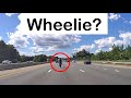 Motorcycle wheelie at highway speed