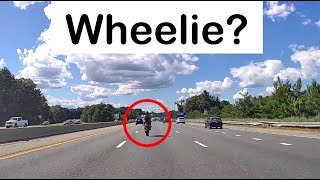 Motorcycle wheelie at highway speed