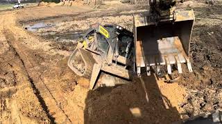 Digging sand and getting skid steer stuck
